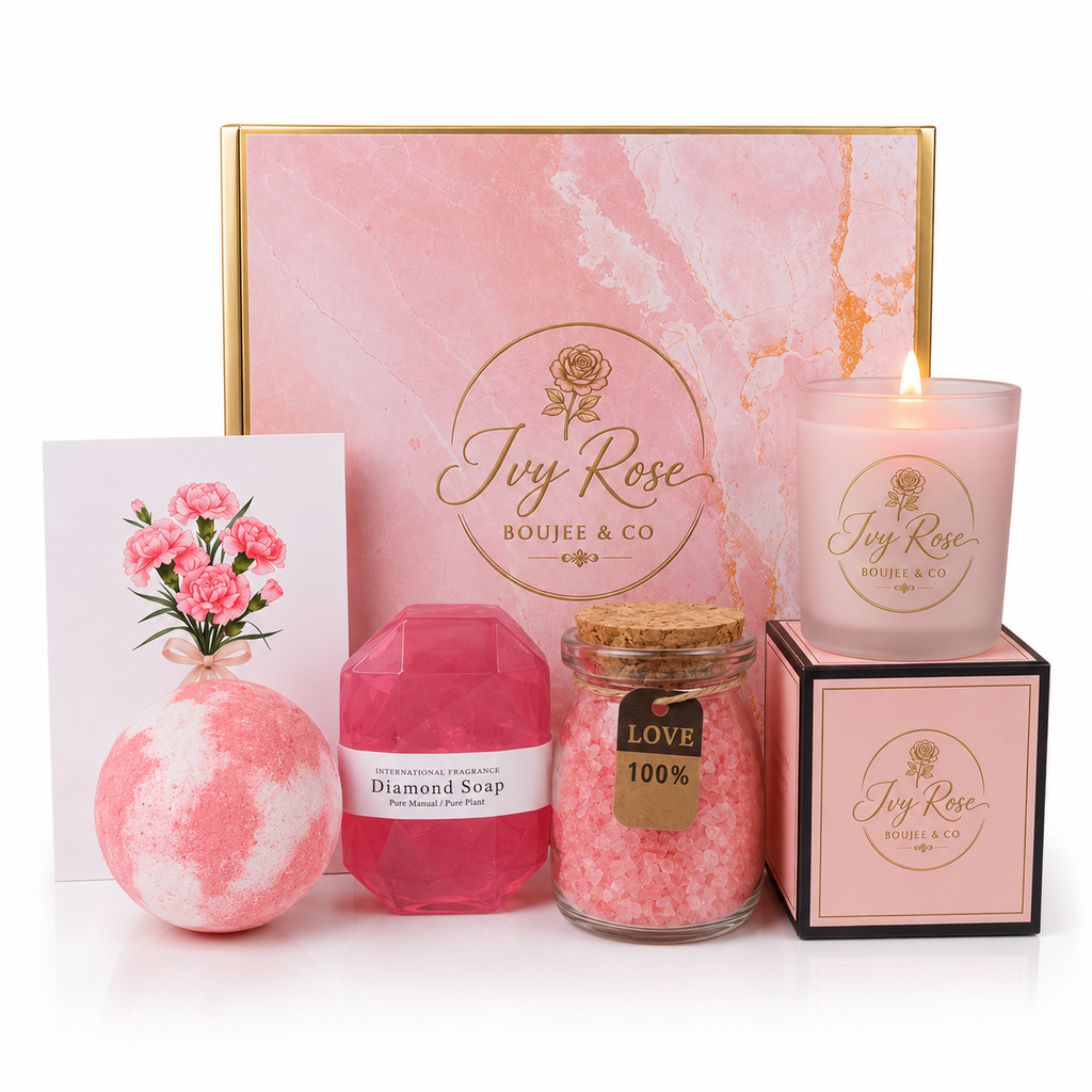 Full contents of the pamper hamper on white background with pink marble box, bath bomb, diamond soap, jar of bath salt grains, lit soy candle and 3D carnation greeting card