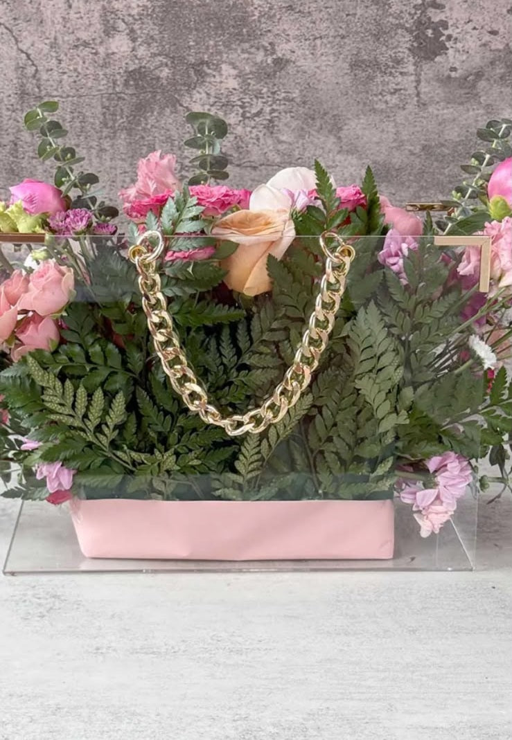 Luxury preserved rose arrangement in acrylic handbag